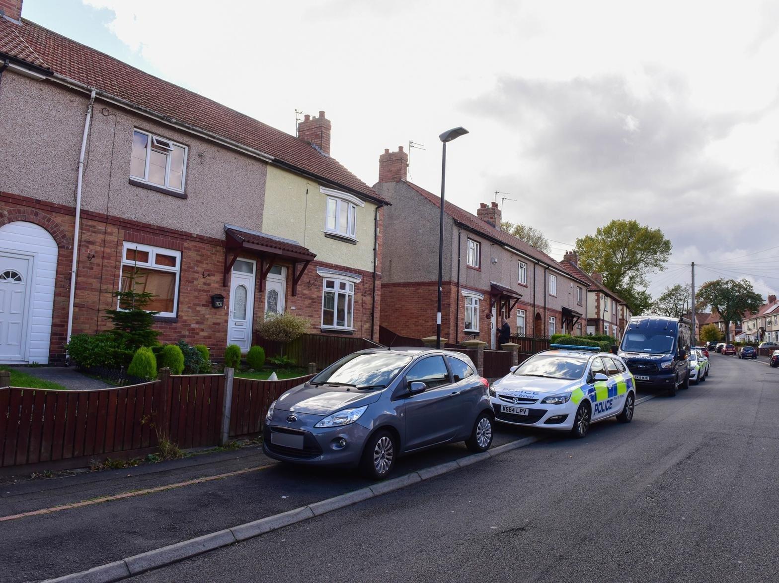 Police outside the house in Shrewsbury Crescent following the discovery of the bodies of Kay Richardson and her husband Alan Martin.
