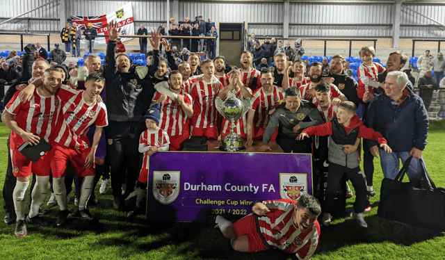 <p>Ryhope CW players, coaches and supporters celebrate their Durham Challenge Cup Final win after they came through a penalty shoot-out to see off Northern League rivals Crook Town</p>