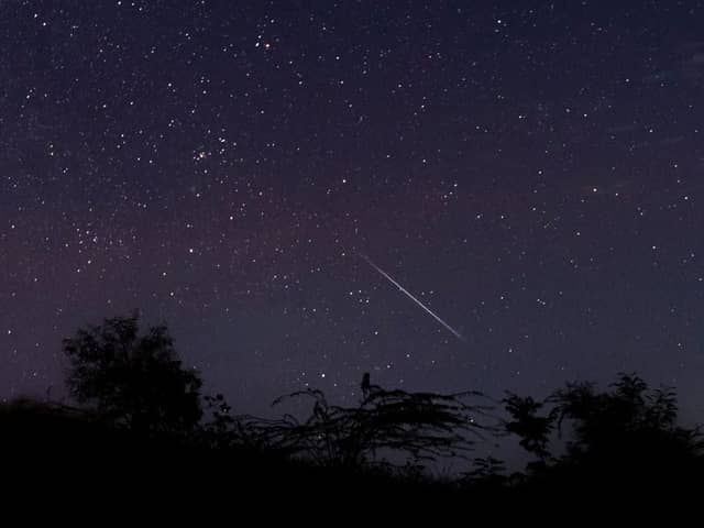 A meteor streaking through the night sky over Myanmar during the Geminid meteor shower in 2018 (Photo: YE AUNG THU/AFP via Getty Images)