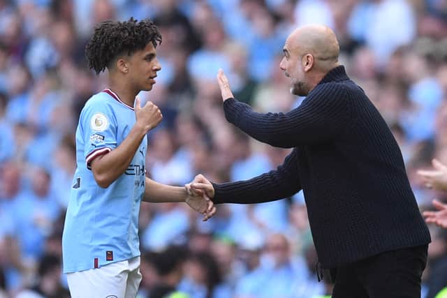 Rico Lewis and Pep Guardiola
