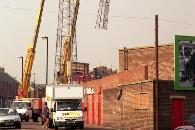 The floodlight pylons are removed in 1997.