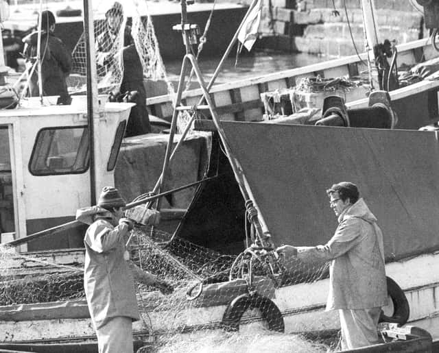 Fishermen mending nets at Sunderland's North Dock in the 1980s.