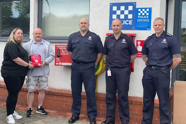 Tanya and Simon Brown with AM Dave Leach, WM Andy Nelson, SM Scott Wilson with the Bleed Kit outside Farringdon Community Fire Station, and two photos of the bleed kits on the side of Farringdon Community Fire Station