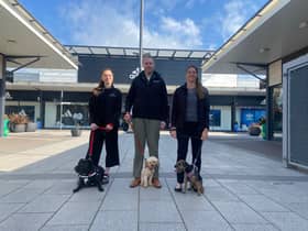 Dalton Park digital marketing assistant Chelsea Pashley, centre manager Richard Kaye and operations manager Jackie Johnson with their pet dogs.