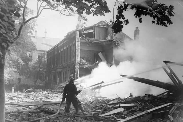 Tackling a fire after an air raid in St George's Square in 1943.