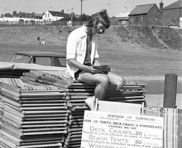 Geoff Bailey (20), takes a break from hiring out deck chairs.
