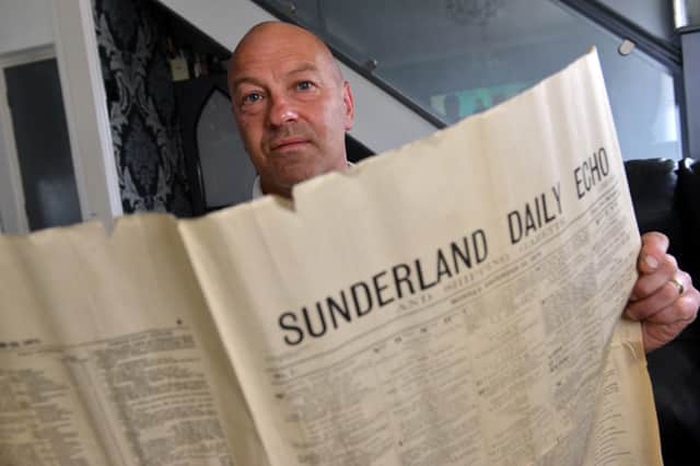Sean Ewart reading what he believes to be an original copy of the first edition of the Sunderland Echo.