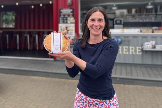 Elena Dickson with the new ham and pease pudding anniversary pi