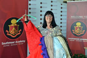 Teaching assistant Nikki Snaith with some of the donated prom dresses.