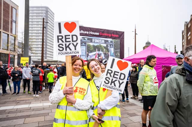 Members of the Red Sky Foundation support team show their love for the cause