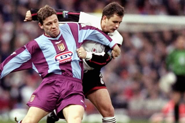 Brian Atkinson in action for Darlington as he challenges Aston Villa’s Alan Thompson in an FA Cup third round match in December 1999 (photo Gary Prior/Allsport)