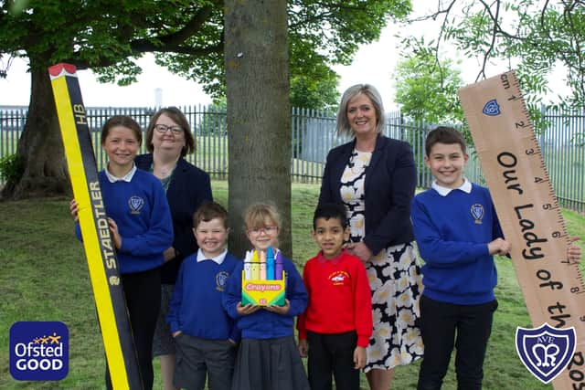 (left to right) Head of school Clare Sutherland and executive headteacher Marie Graham with pupils of Our Lady of the Rosary Catholic Primary School.