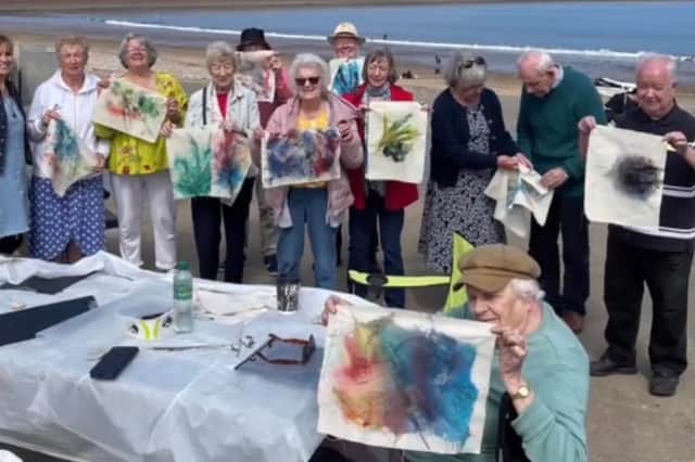 Together In Southwick members show off their artwork after one of their many excursions.