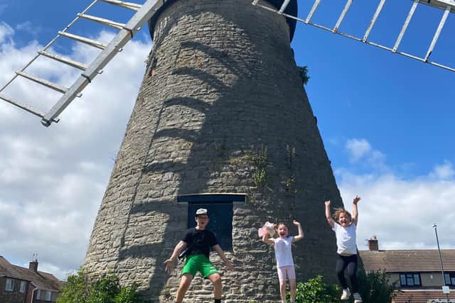 Ava Ramshaw-Nesbitt, Phoebe Haydon-Jones and Lex Logan celebrate completing their three windmills challenge.