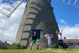 Ava Ramshaw-Nesbitt, Phoebe Haydon-Jones and Lex Logan celebrate completing their three windmills challenge.