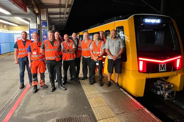 Members of the test team with the new train