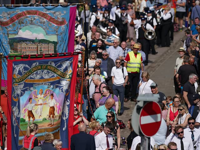 Colliery banners are carried through the city on July 09, 2022 in Durham, England. The 136th Durham Miners Gala, also known as The Big Meeting