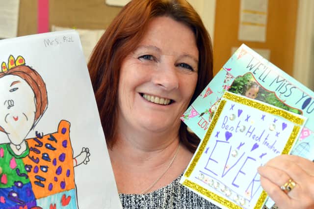 Tracey Pizl with some of the cards she received from the children and their parents.