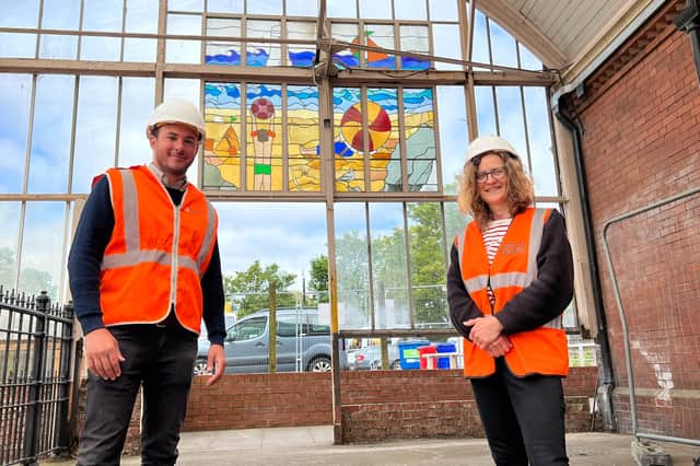 Stained glass artist Cate Watkinson and Nexus Project Manager Simon Manley next to the canopy and stained glass art work at Monkseaton Metro station ahead of its being removed for restoration work.