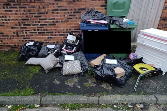 Picture issued by Sunderland City Council of waste dumped in a back lane.