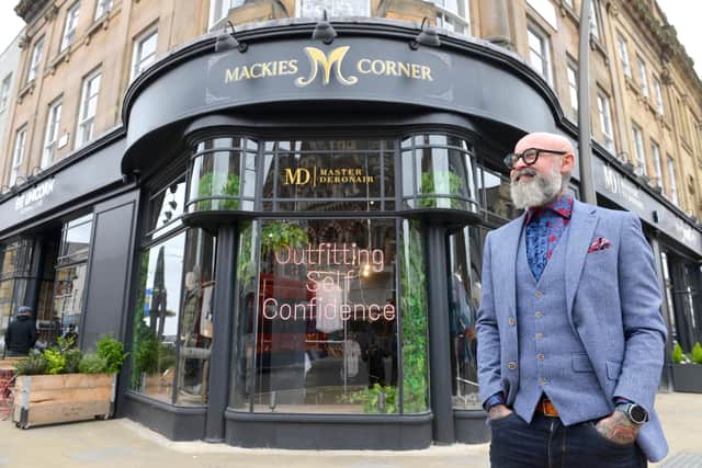 Simon Whittaker outside the store at Mackie's Corner in 2021.