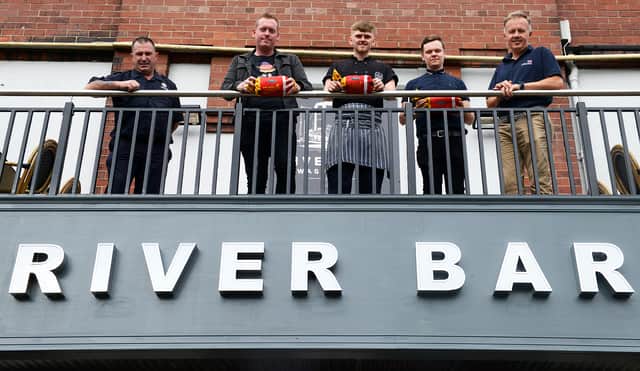 (left to right) Firefighter Tommy Richardson of TWFRS, Chef Tyler Wemyss, patron Matthew Cadas and Tony Wafer, Senior Water Safety Manager, RNLI.  They are pictured holding throwbags outside of The River Bar. Picture c/o TWFRS