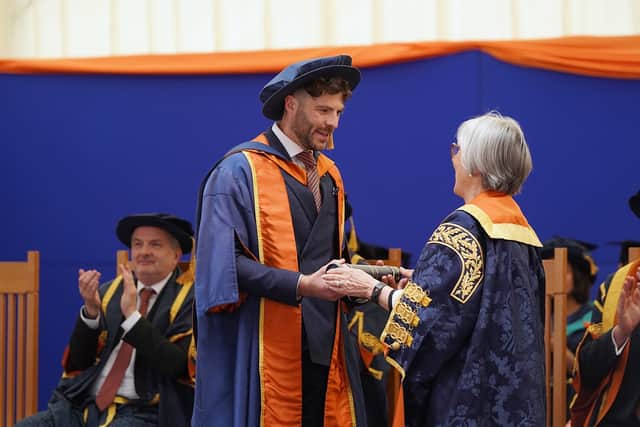 Jordan North receiving his honorary fellowship from the University of Sunderland.