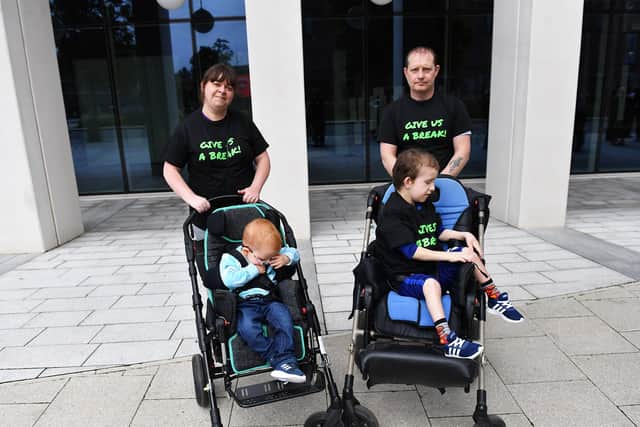 Give Us A Break protesters Laura Grainger with her son Lucas and partner Neil Nicholson with Brendon Grainger