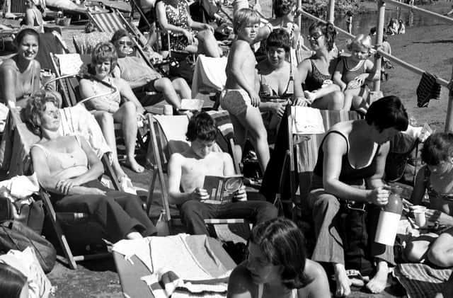 Lots of faces including one young man reading up on the Highway Code in August 1974.