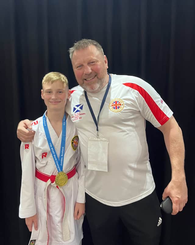Submitted picture of Caleb Dickinson with Coach Sensei Ed Gillespie.