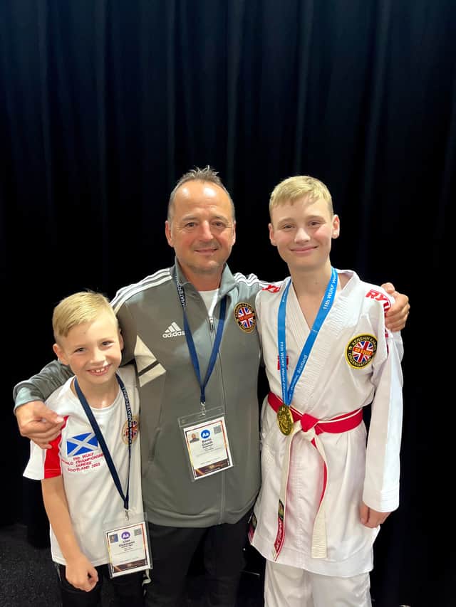 Submitted picture of  Cian Dickinson, Sensei Kevin Gooch and Caleb Dickinson 