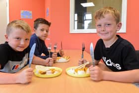 Children enjoying a healthy hot meal as part of the Wear Here 4 Summer programme.