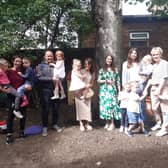 Samantha Smith (centre) with some of the parents and children from Little Acorns Preschool Nursery.
