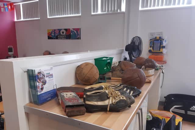 Some of the old footballs, boots and rattles.
