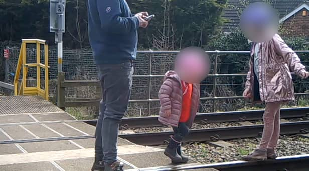 Shocking footage shows young children being played on the tracks 