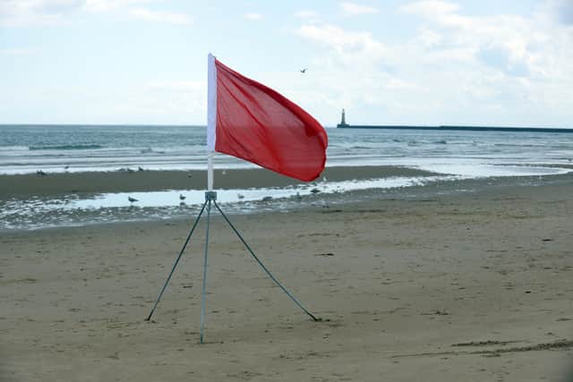 The red flag flying at Roker Beach. 