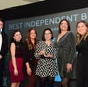 The team from Clixifix Customer Care receive their Best Independent Business of the Year Award from Coun Kevin Johnson (left) 
