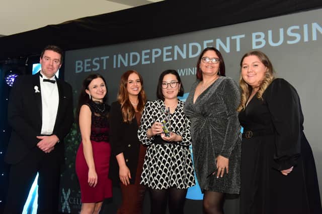 Memebrs of the Clixifix team receive their Best Independent Business of the Year Award from Coun Kevin Johnson
