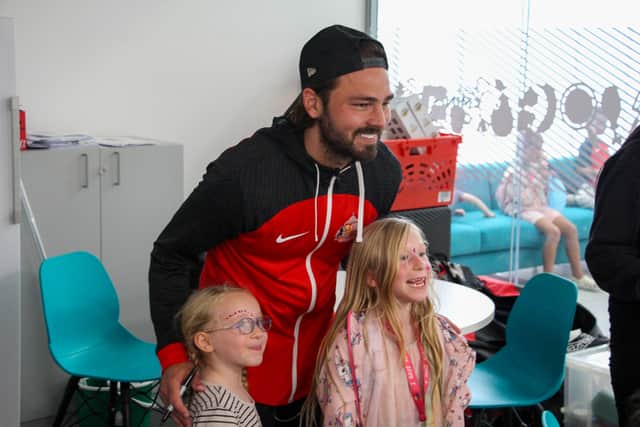 Bradley Dack with young fans at the Beacon of Light.
