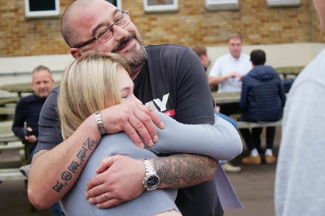 Robyn Conlin celebrates her GCSE results with her dad.