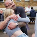 Robyn Conlin celebrates her GCSE results with her dad.