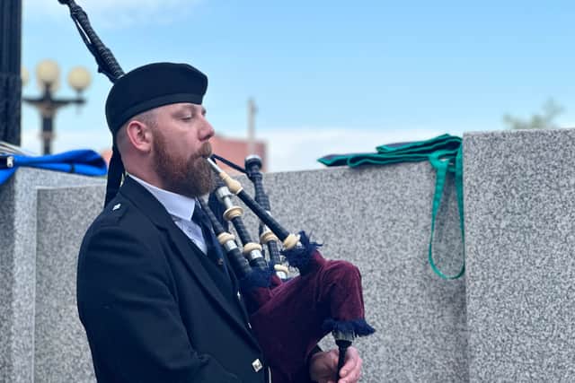 A piper at the ceremony