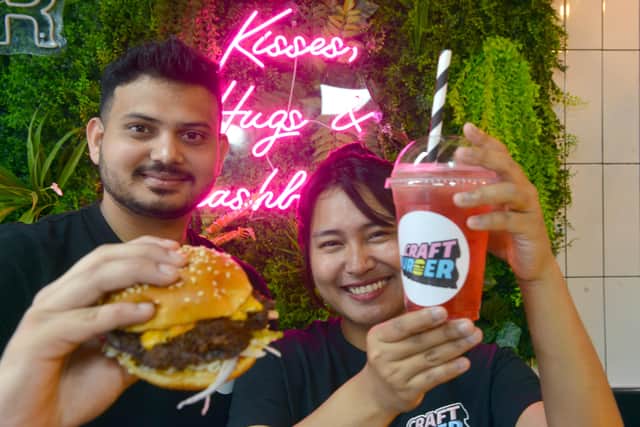 
The new Craft Burger opens in Grangetown with staff from left Manideep Bolishetty and Thiri Theingi Aung.

