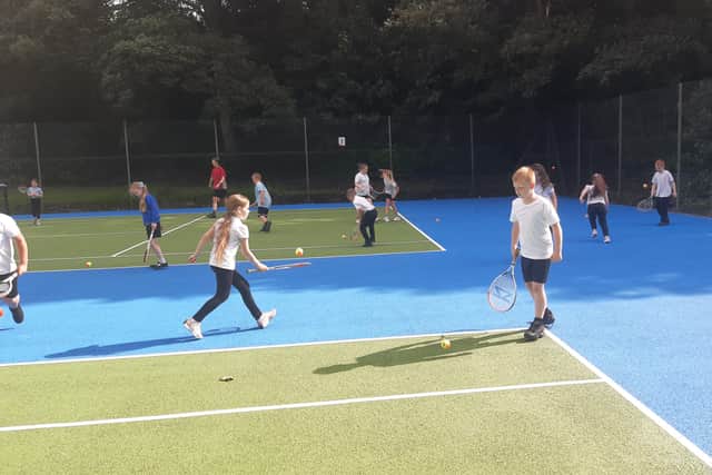 Children from Hetton Primary School practising their tennis skills.
