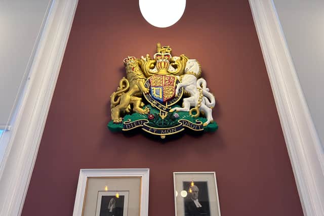 The Royal Crest and former judges from the building's time as a County Court