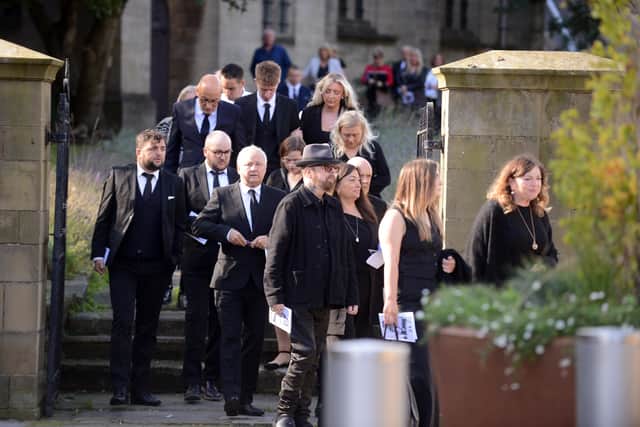 Dave Stewart and fellow mourners as the city says goodbye to Faye