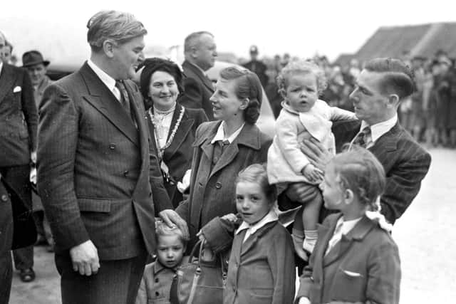 Aneurin Bevan meeting the new tenants, Mrs and Mrs John Bradley, and their family of four.