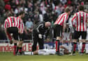 Alan Shearer on the ground at the Stadium of Light after a coming together with Julio Arca 