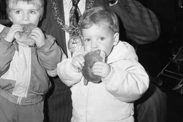 Michael Lishman, 2, right; Alan Morton, 3, and The Mayor Sunderland, Councillor John Mawston were the first to taste the roast ox in 1987.