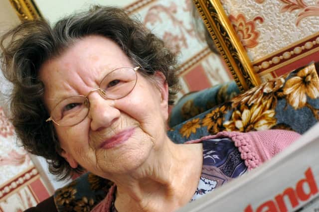 Ellender with a copy of her favourite paper in 2009 when she was 86.